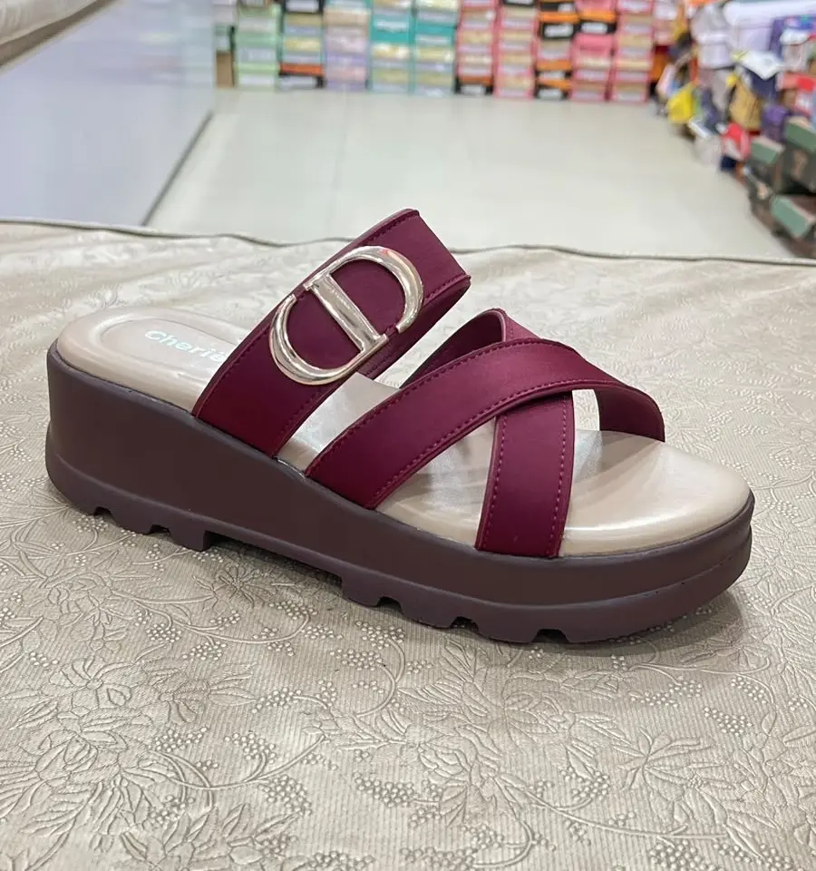 Maroon cross-strap wedge sandals with gold buckle cropped